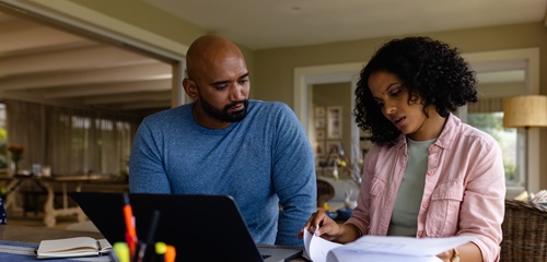 Father and daughter looking at finances